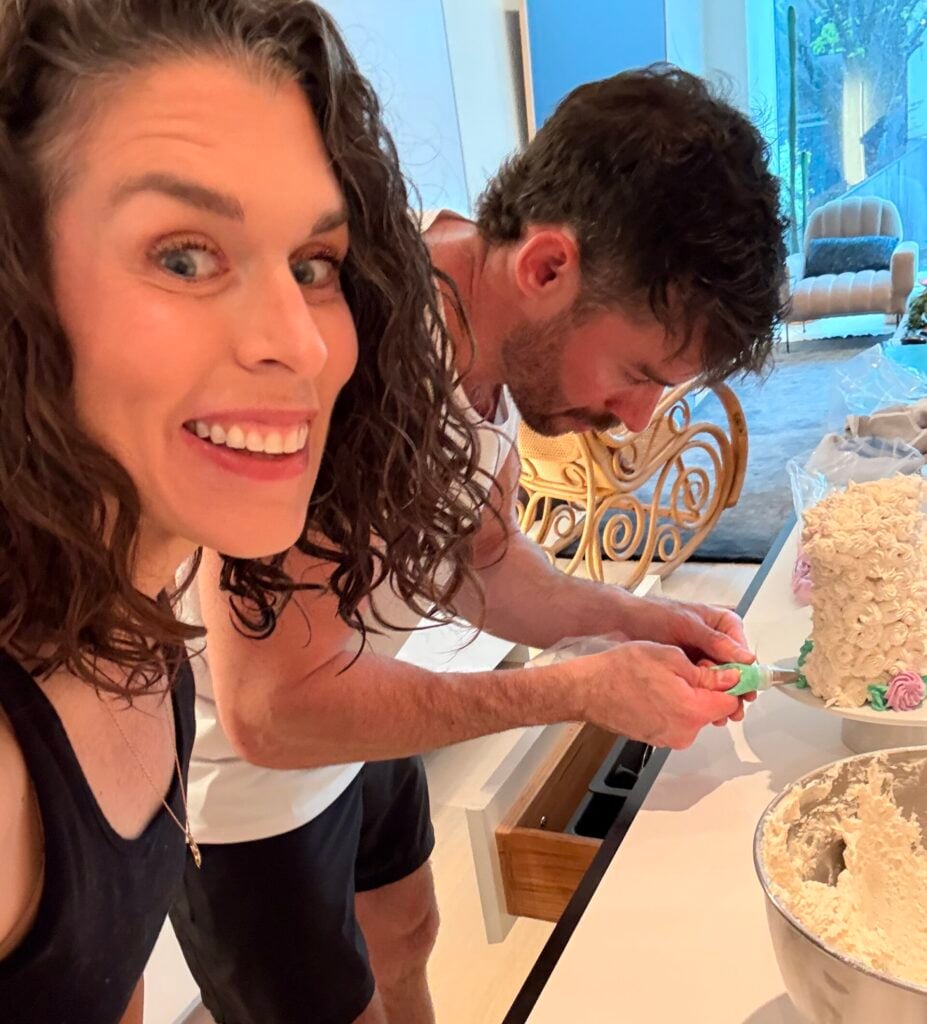 easter lamb cake getting iced with family