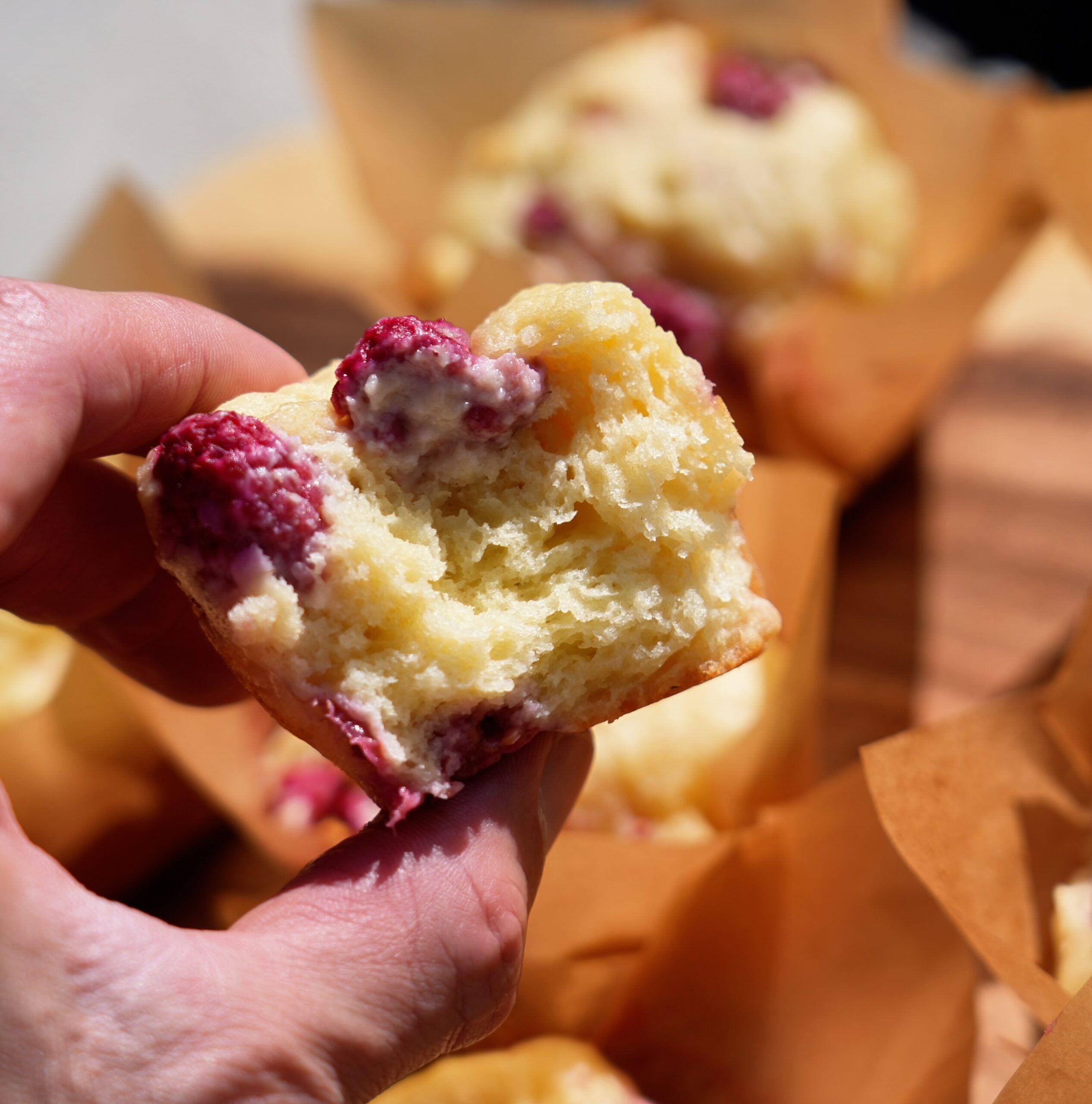 half of a raspberry protein muffin