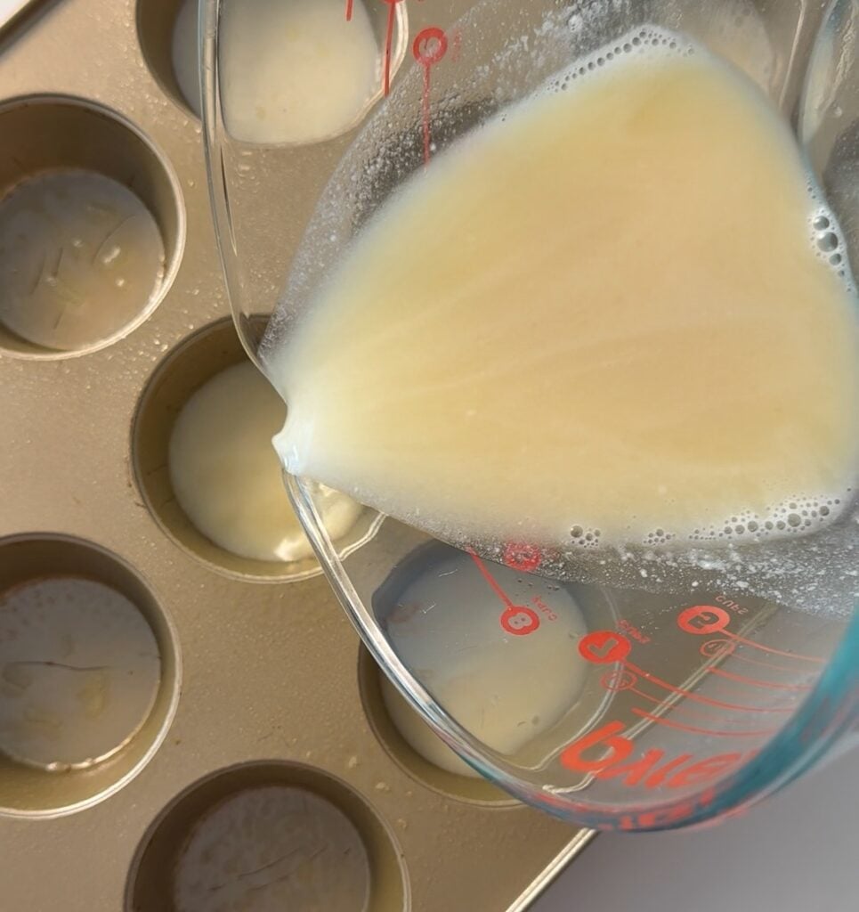 Pouring liquid into the muffin cups