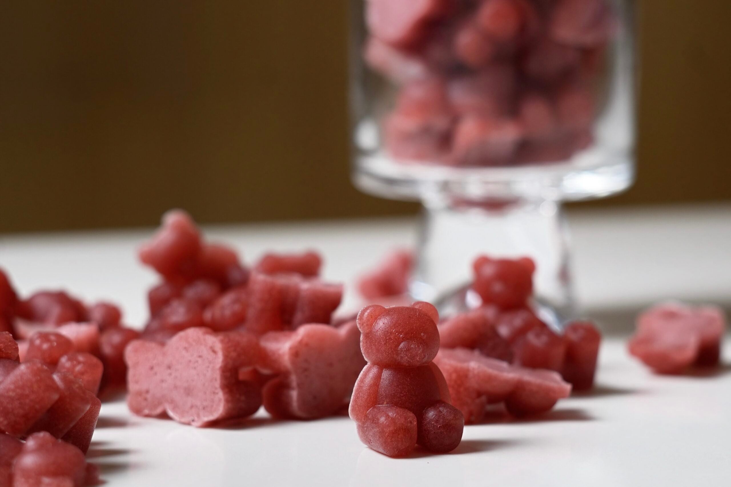 shot of acv gummies on table