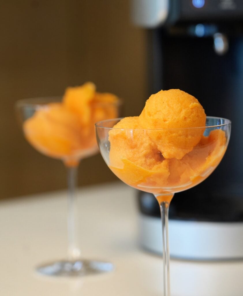 close up carrot and orange sorbet with creami machine