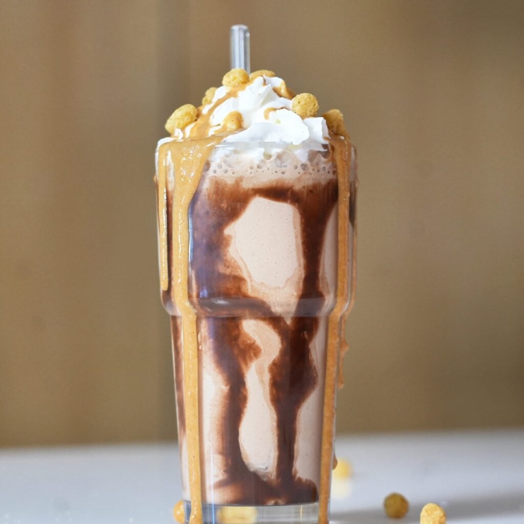 close up chocolate peanut butter protein shake on counter