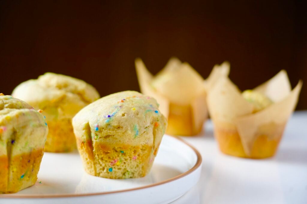 funfetti protein muffin on plate wide shot