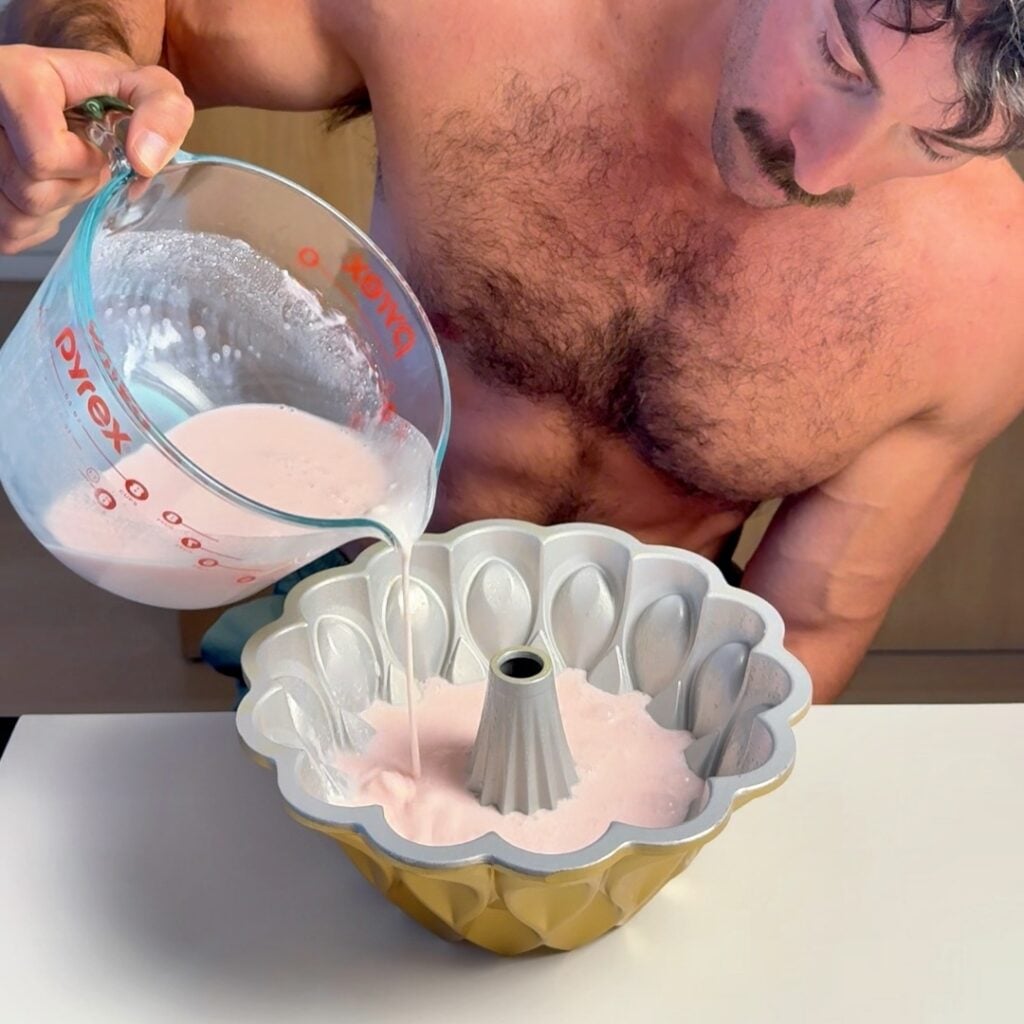 pouring pink gelatin into mold