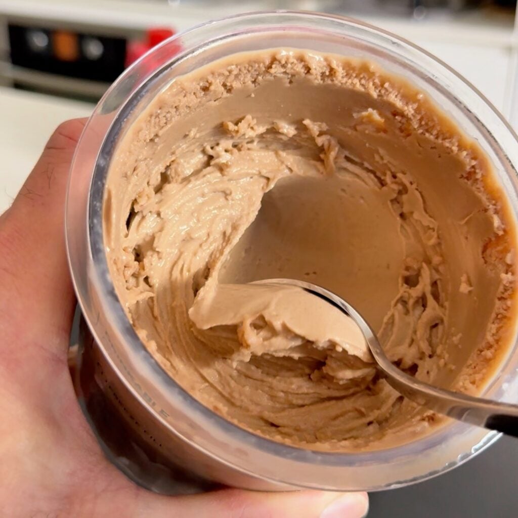 scooping peanut butter ice cream creami