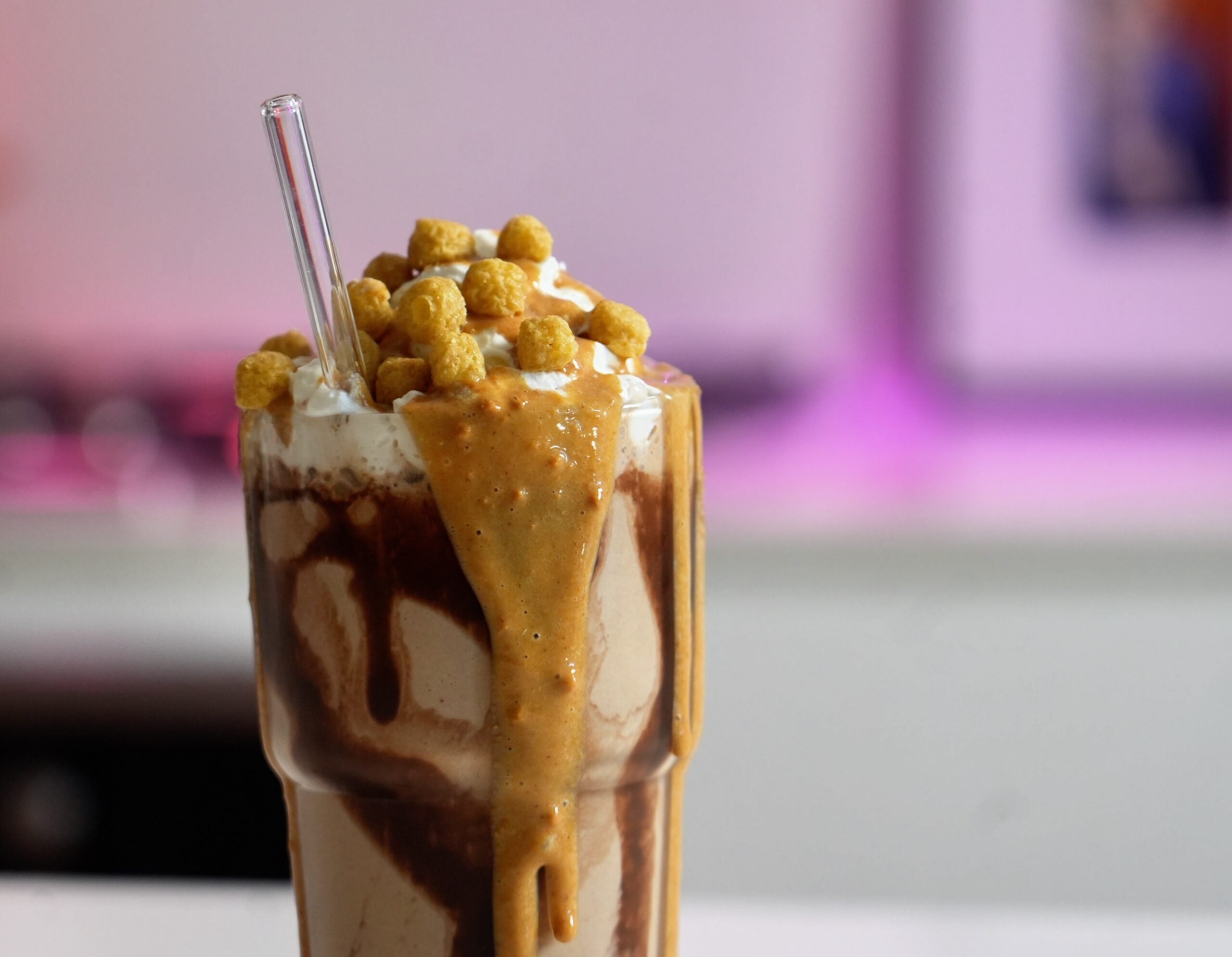 super close up chocolate peanut butter protein shake on counter