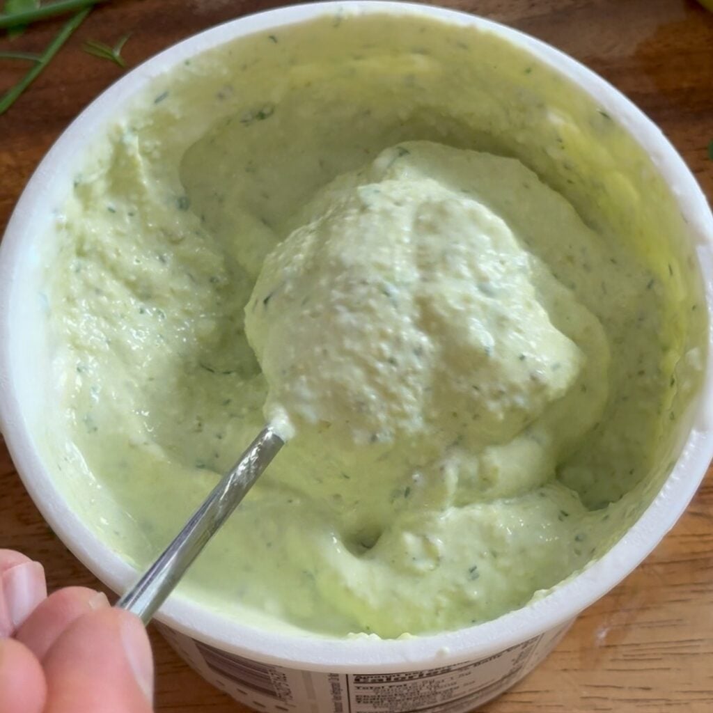 adding pickles and herbs smooth and creamy