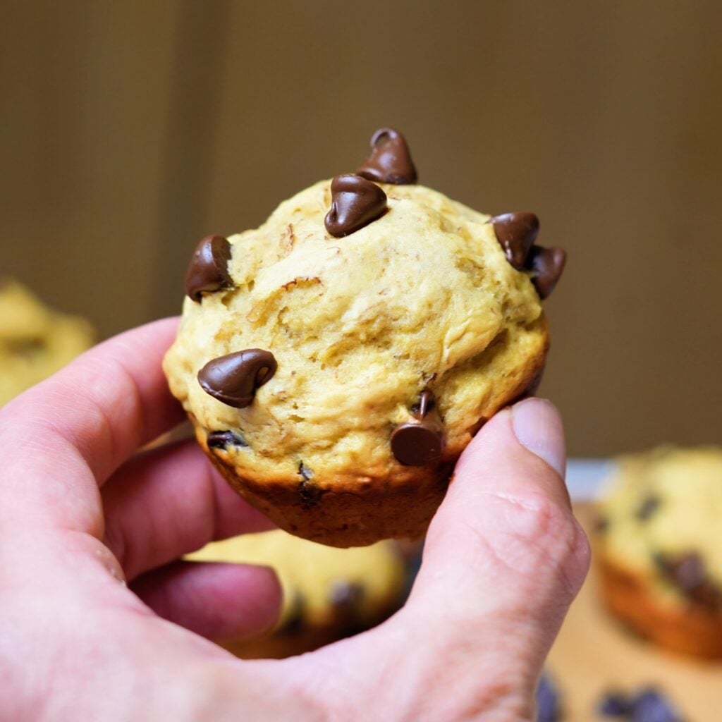 high protein banana bread muffin in hand