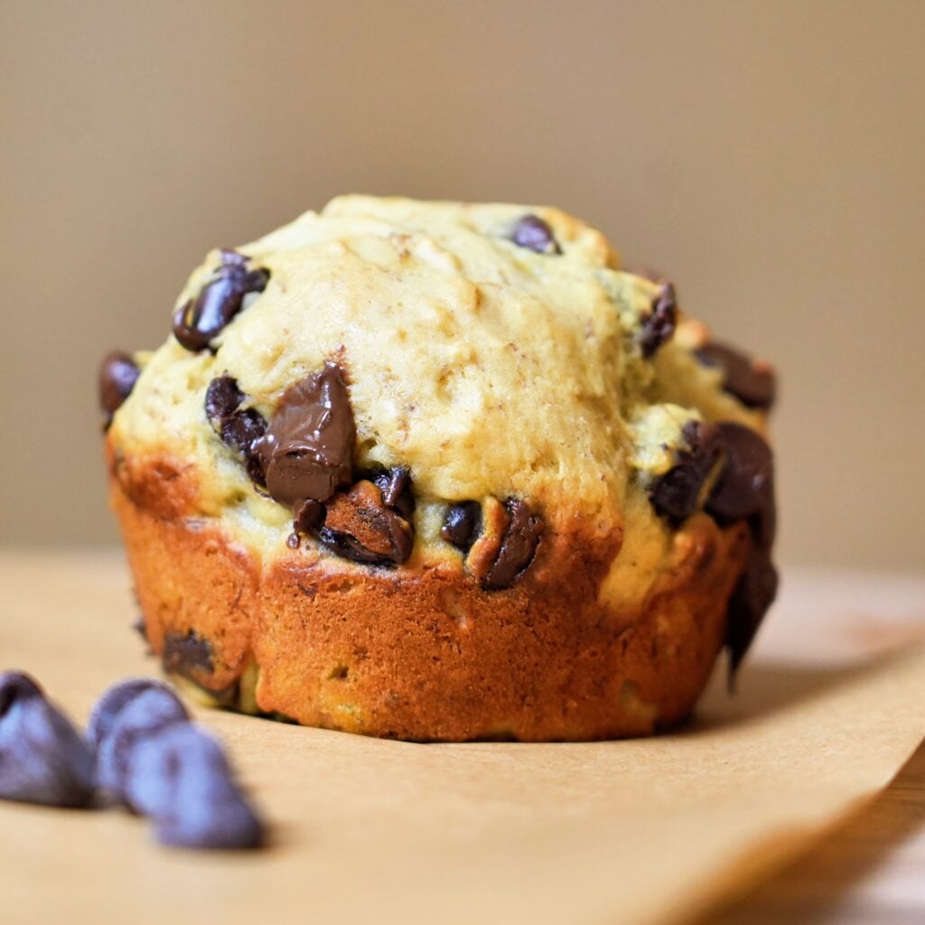 high protein banana bread muffin with chips close up