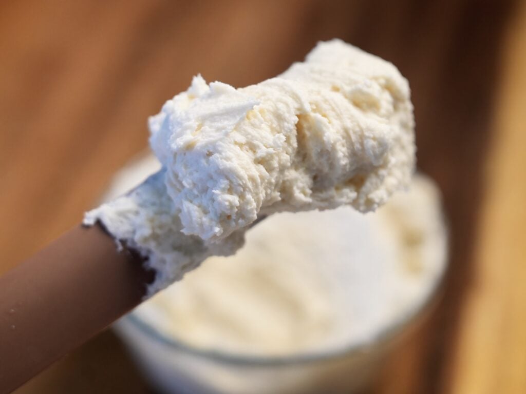 high protein cream cheese frosting on spatula