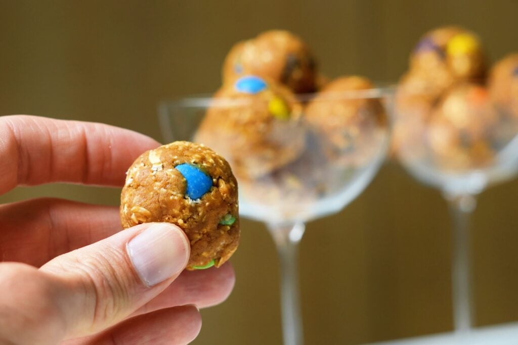 high protein monster cookie balls in hand