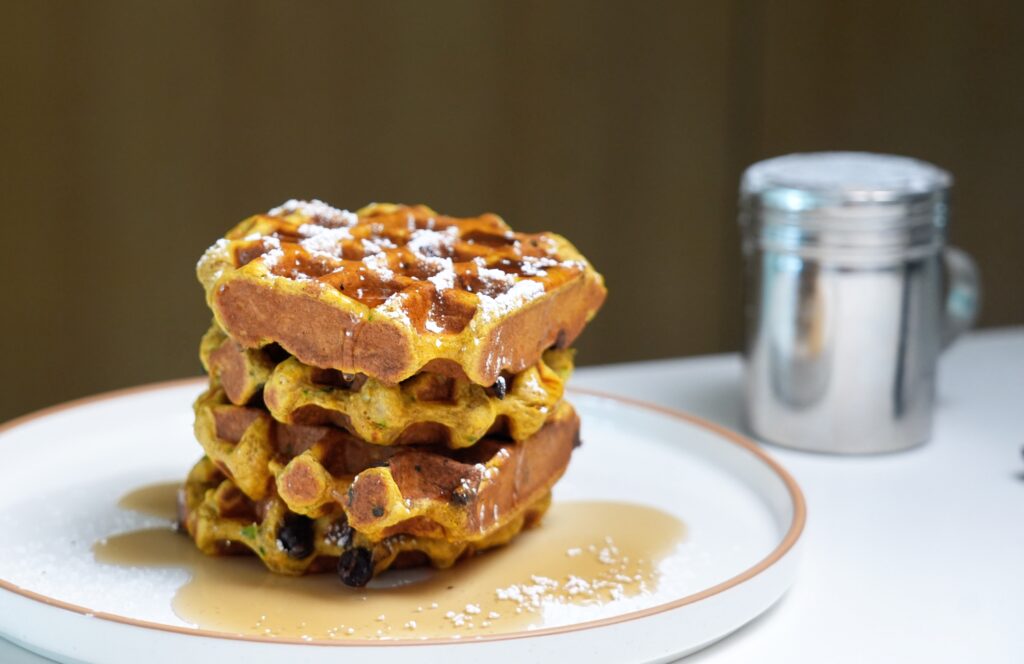 high protein zucchini bread waffles wide shot