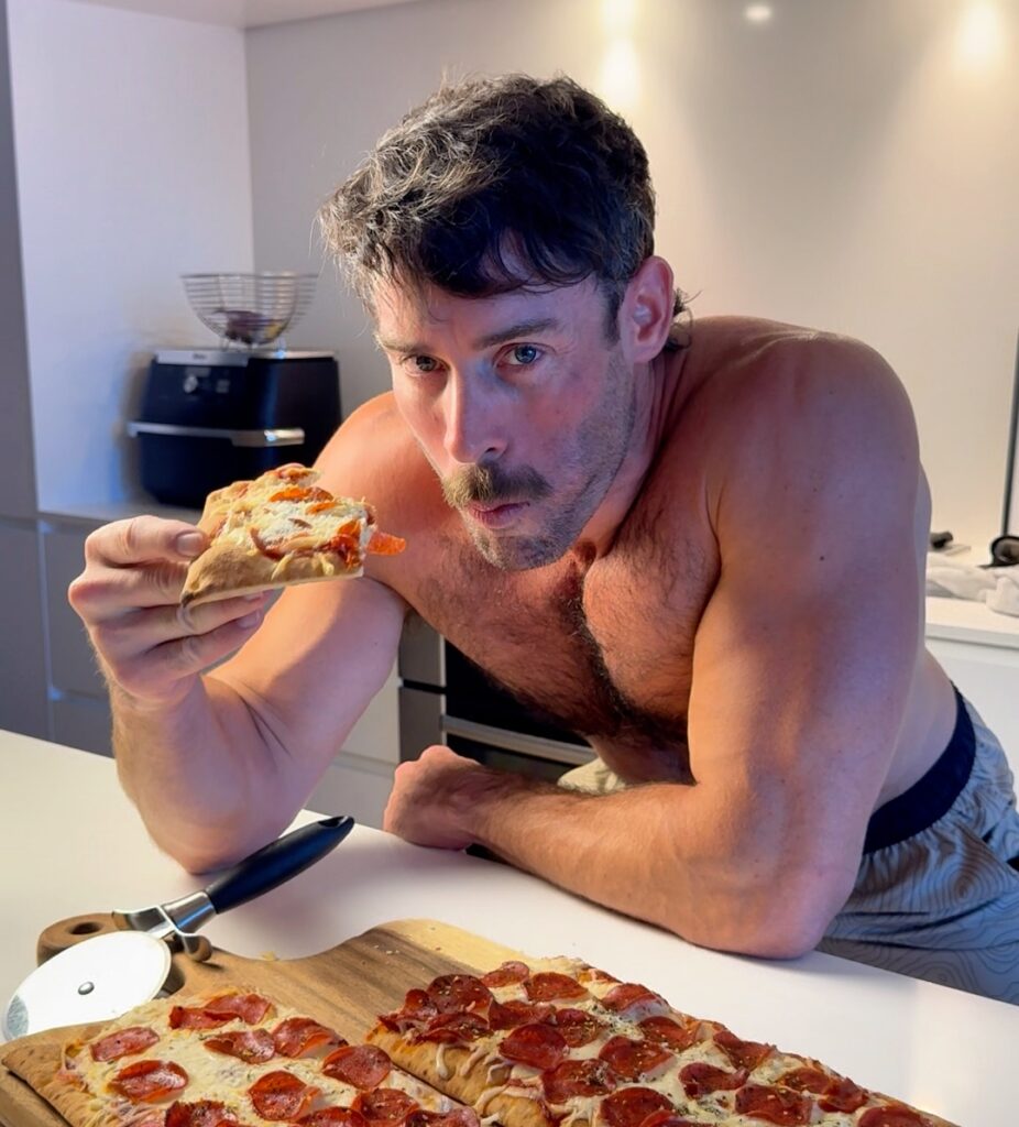 jacob eating high protein pepperoni pizza slice