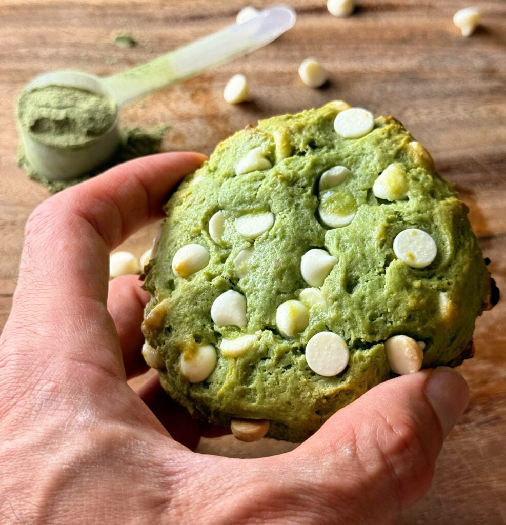 matcha and greens protein cookie in hand