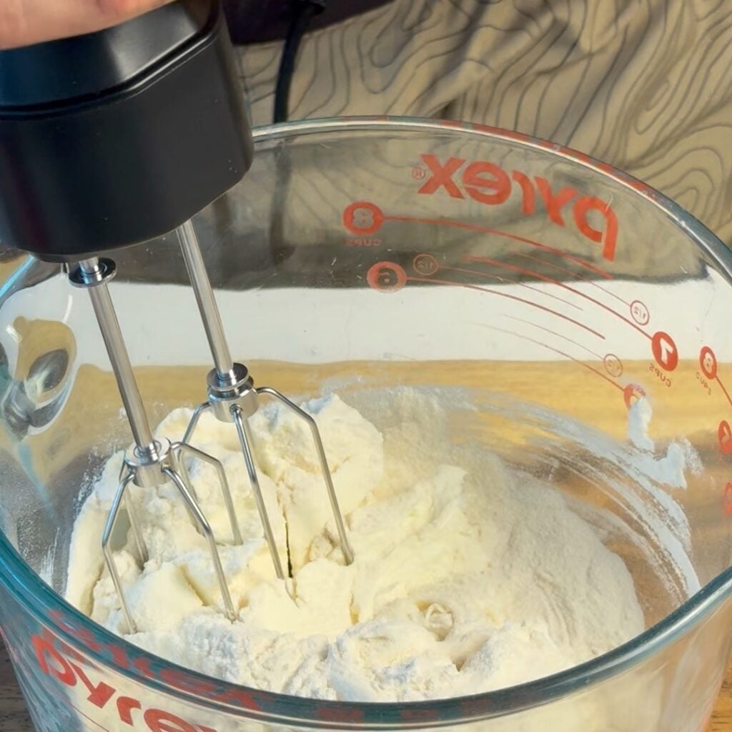 mixing the high protein cream cheese frosting