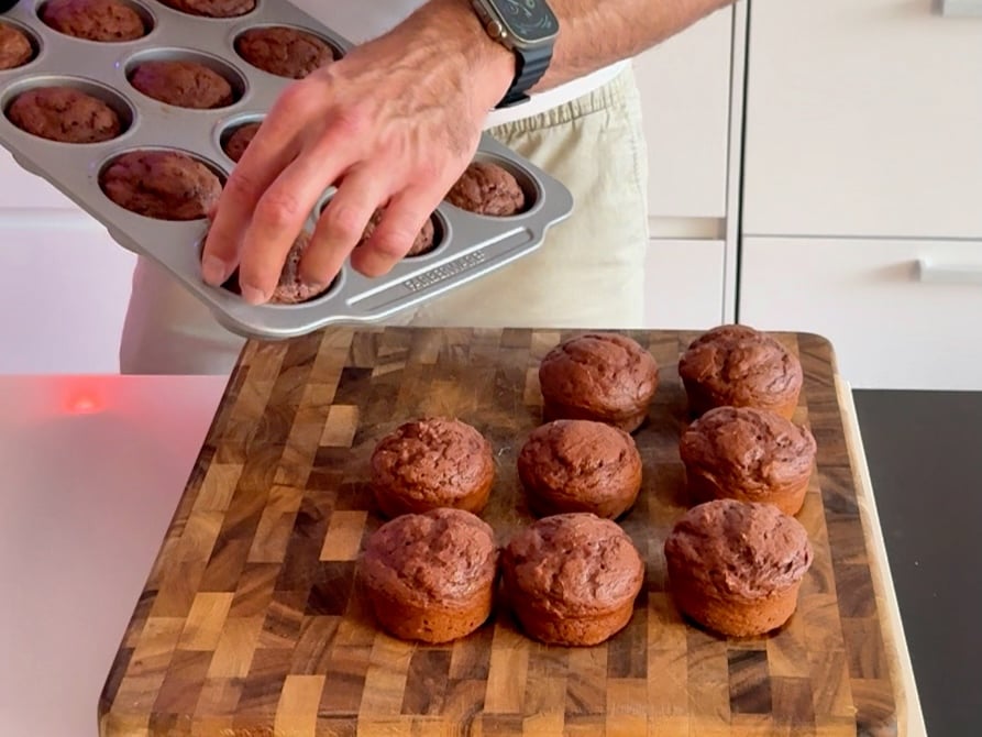 placing the easy protein muffins on tray