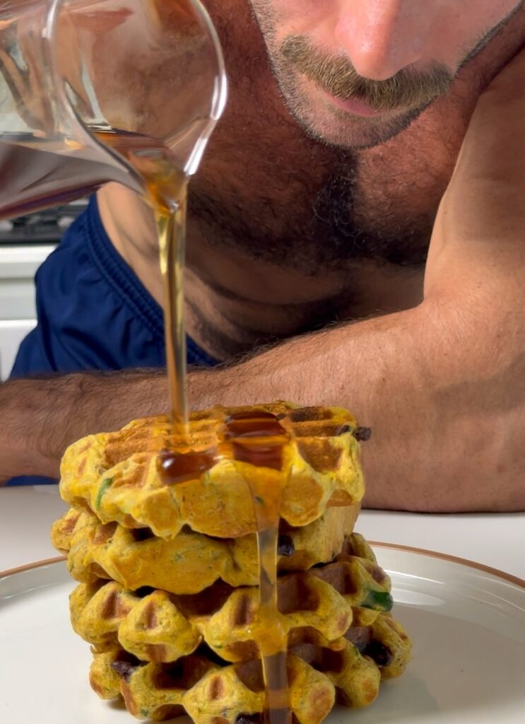 pouring syrup on waffles