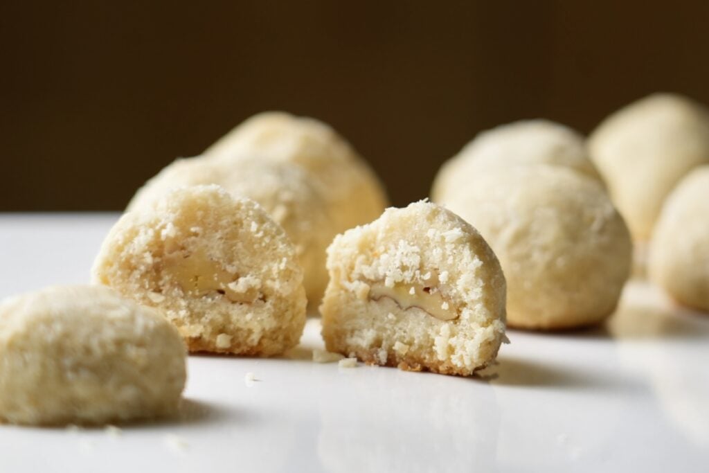 row of coconut surprise cookies with nuts