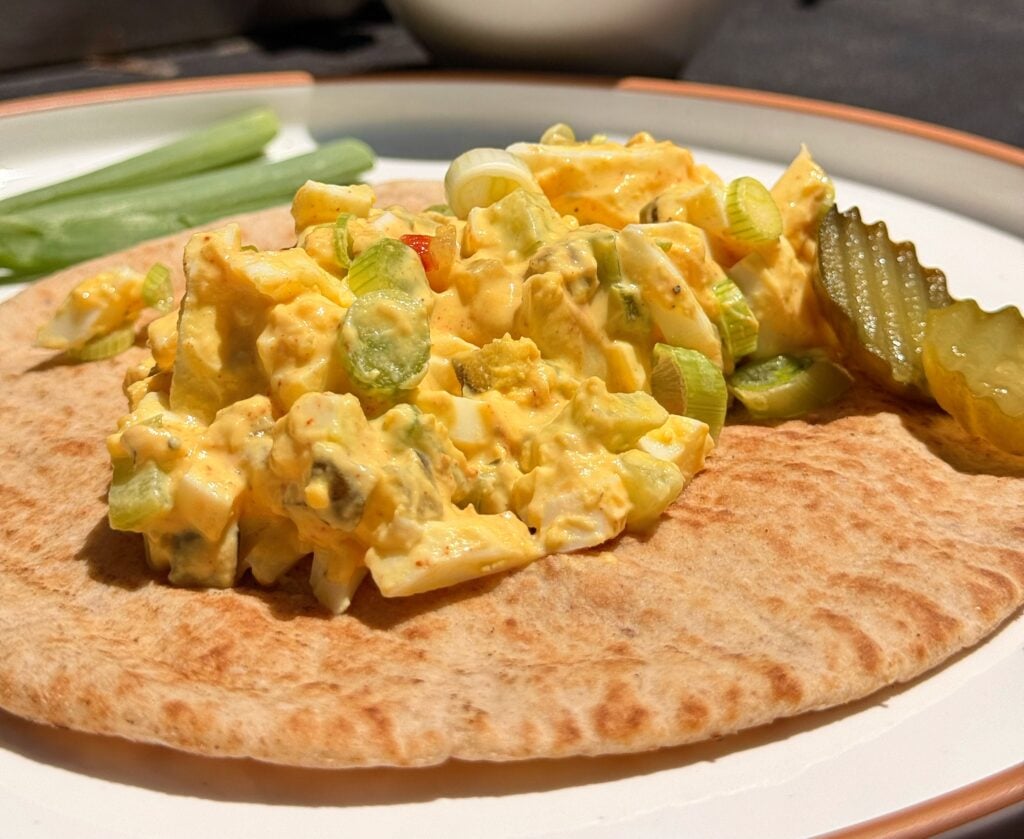 spicy pickle egg salad on table close up on table outside