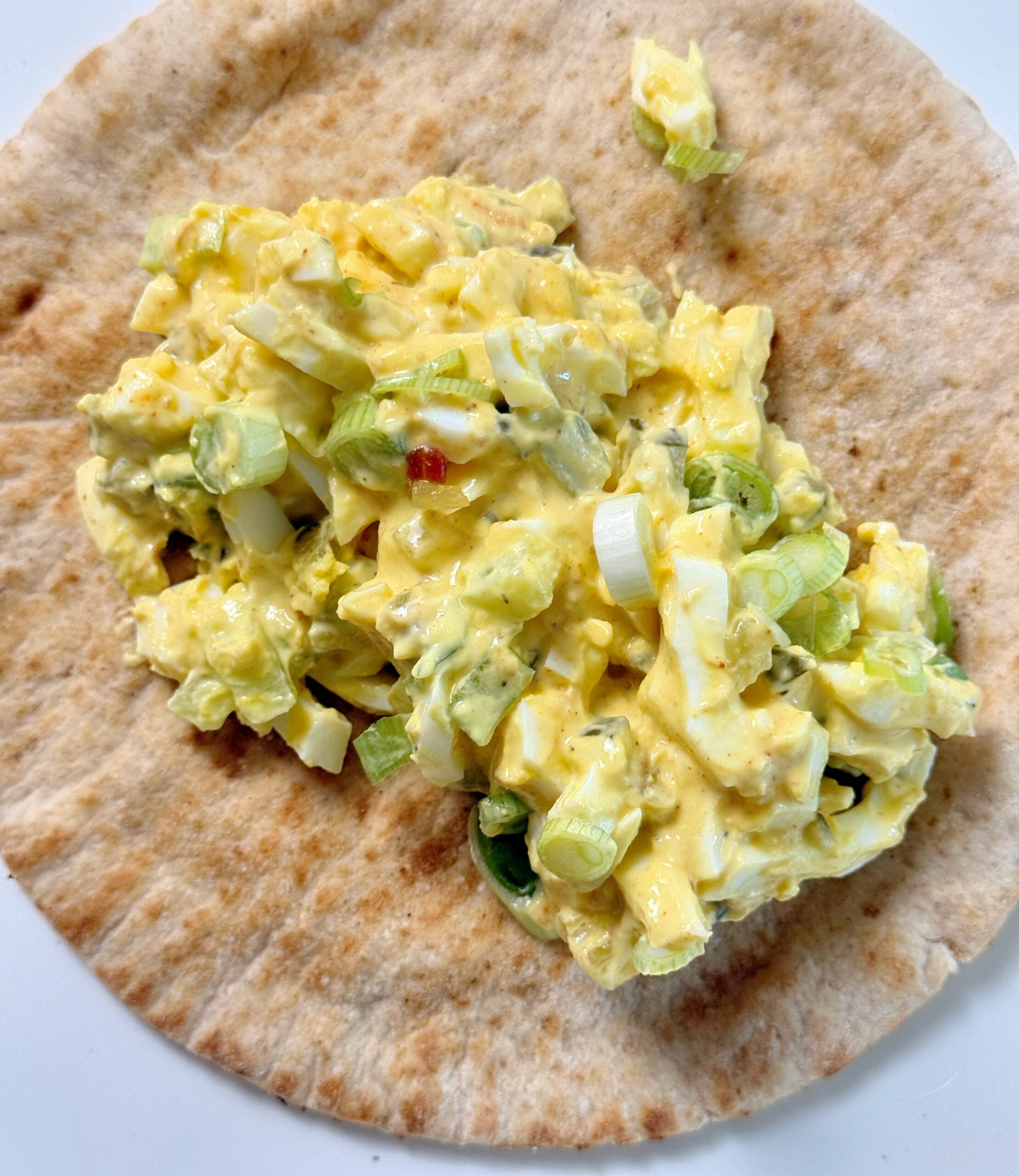 spicy pickle egg salad on table close up
