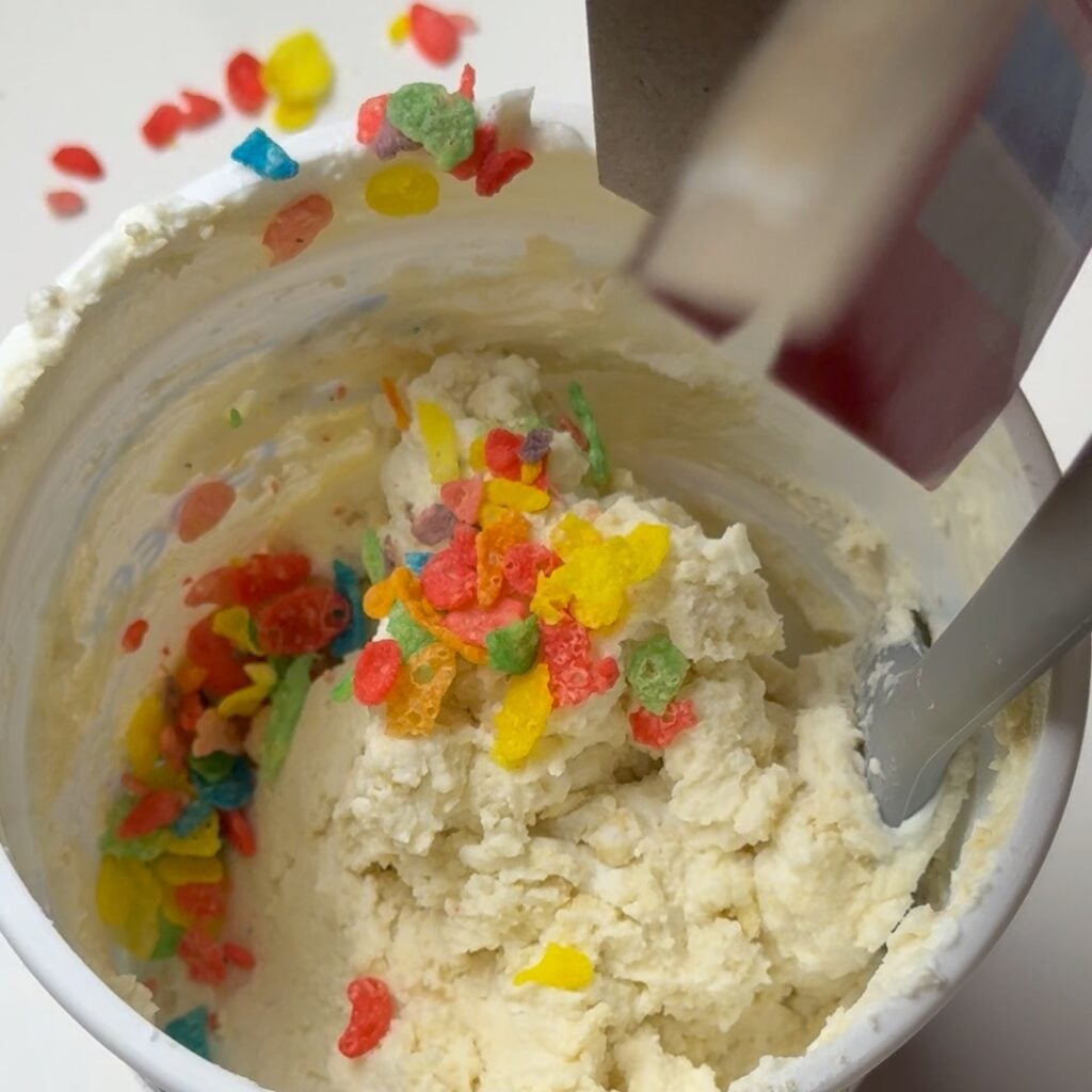 adding cereal to the yogurt base