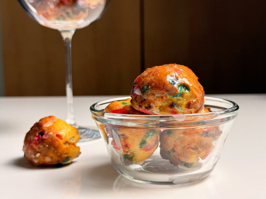 close up of donut holes on table