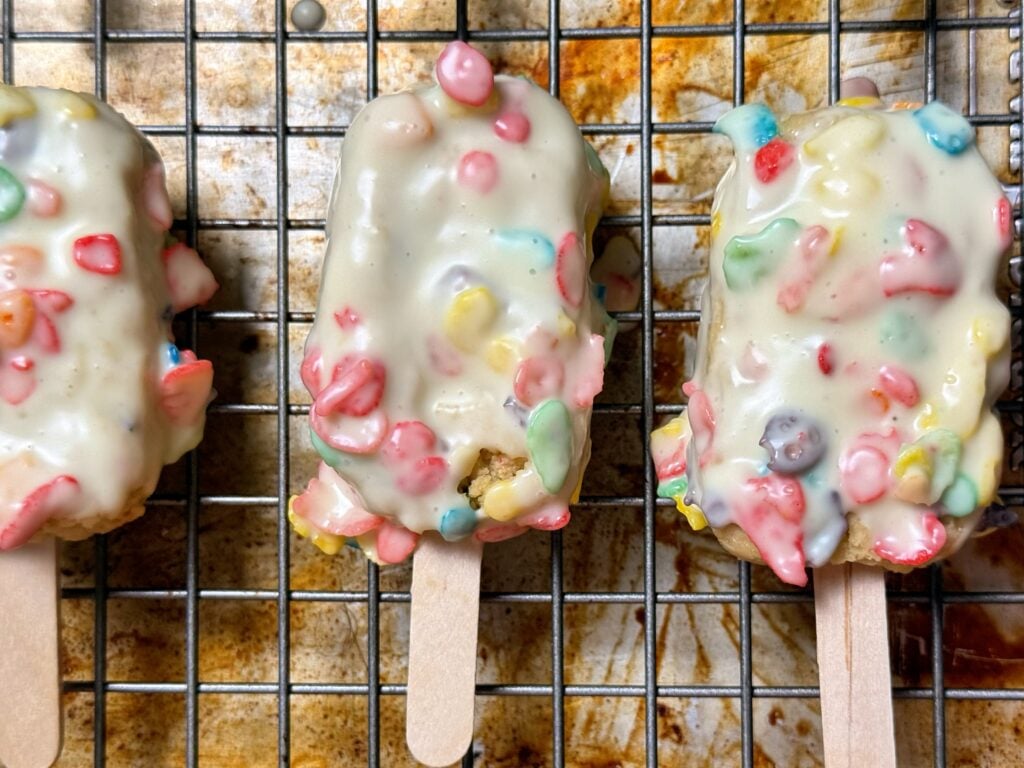 high protein fruity pebbles cake pop on rack