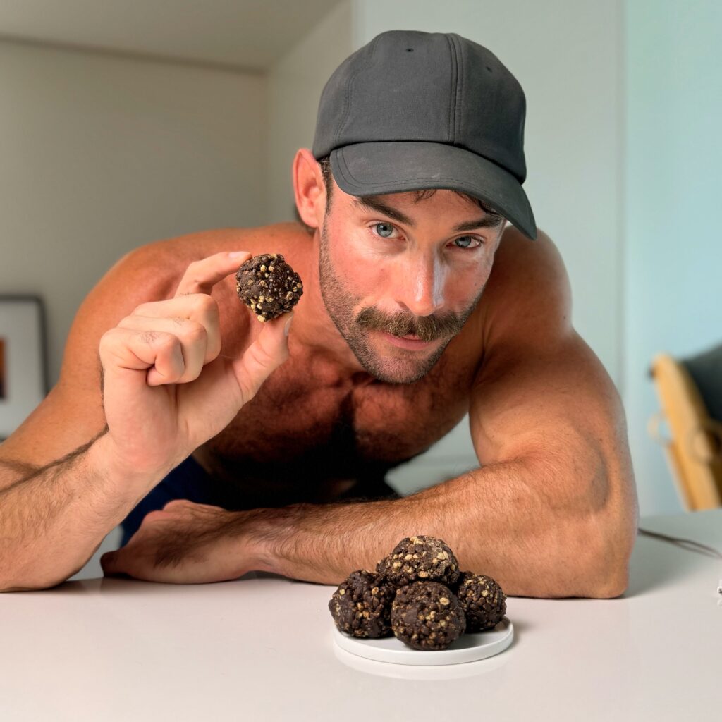 jacob holding a chocolate protein truffle