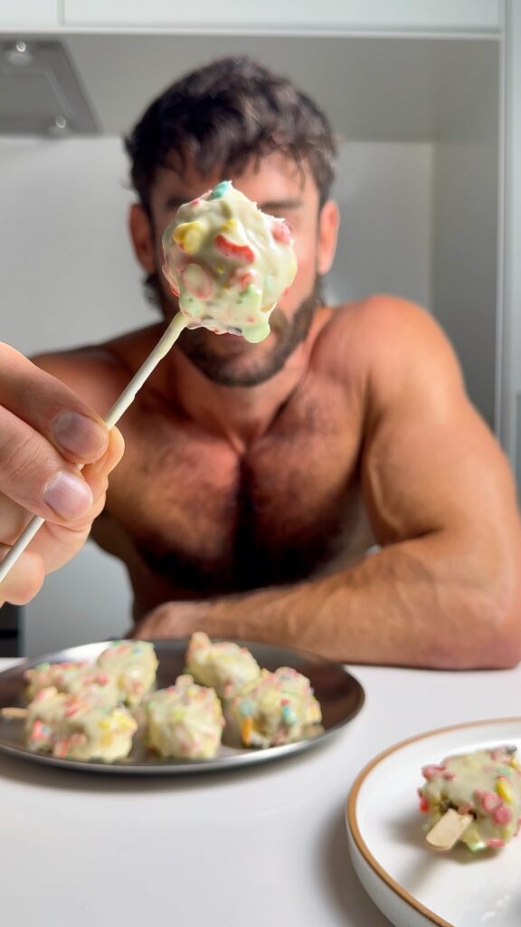 jacob holding a round cake pop