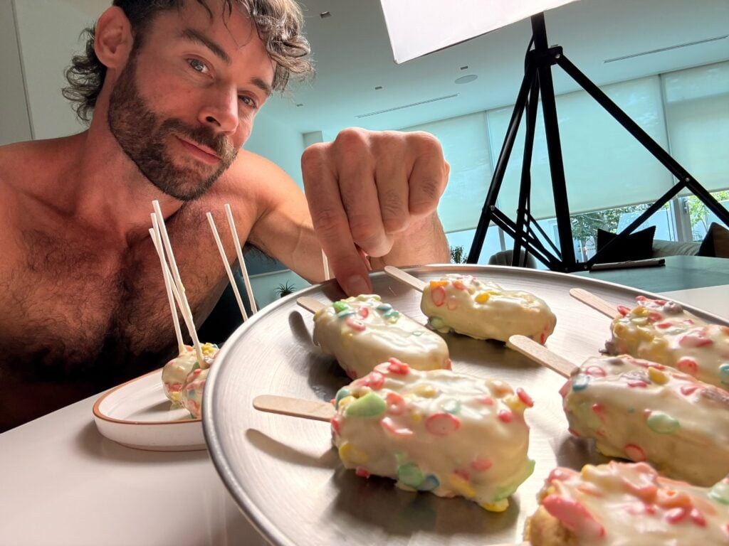 jacob with high protein fruity pebbles cake pop on rack