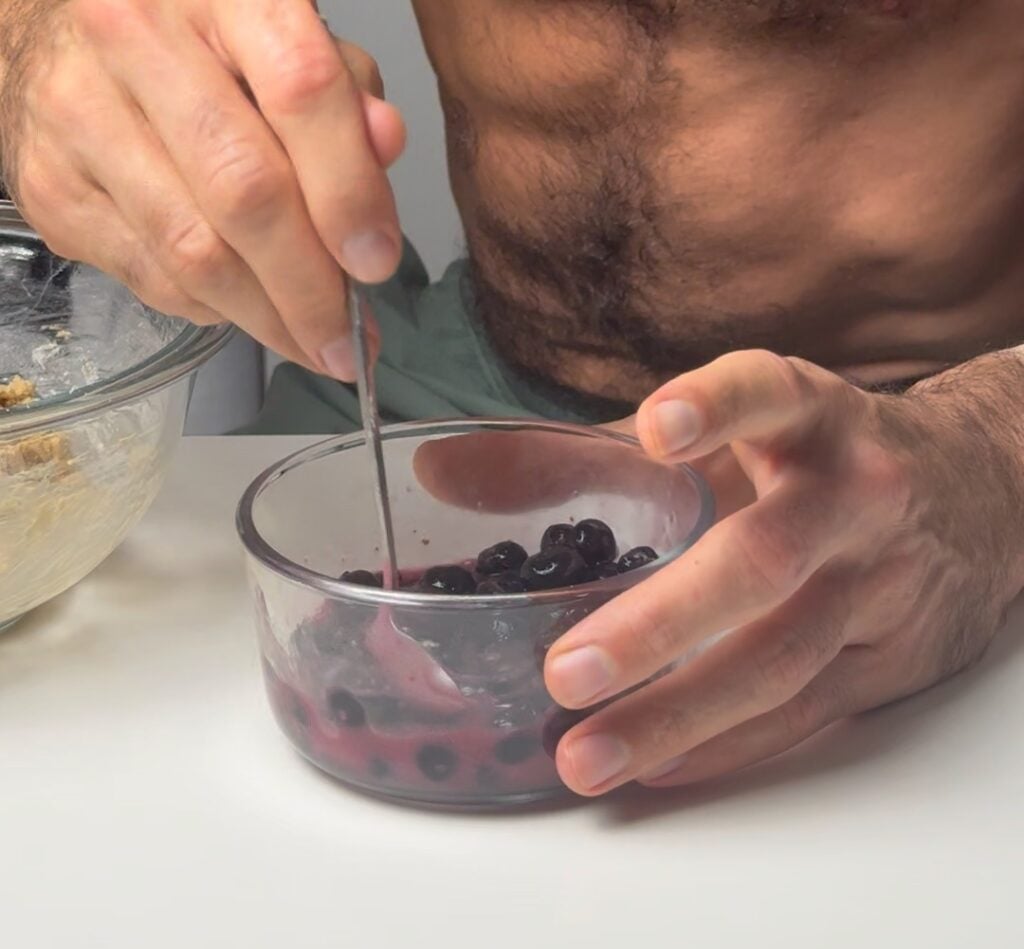 mixing cornstarch and blueberries