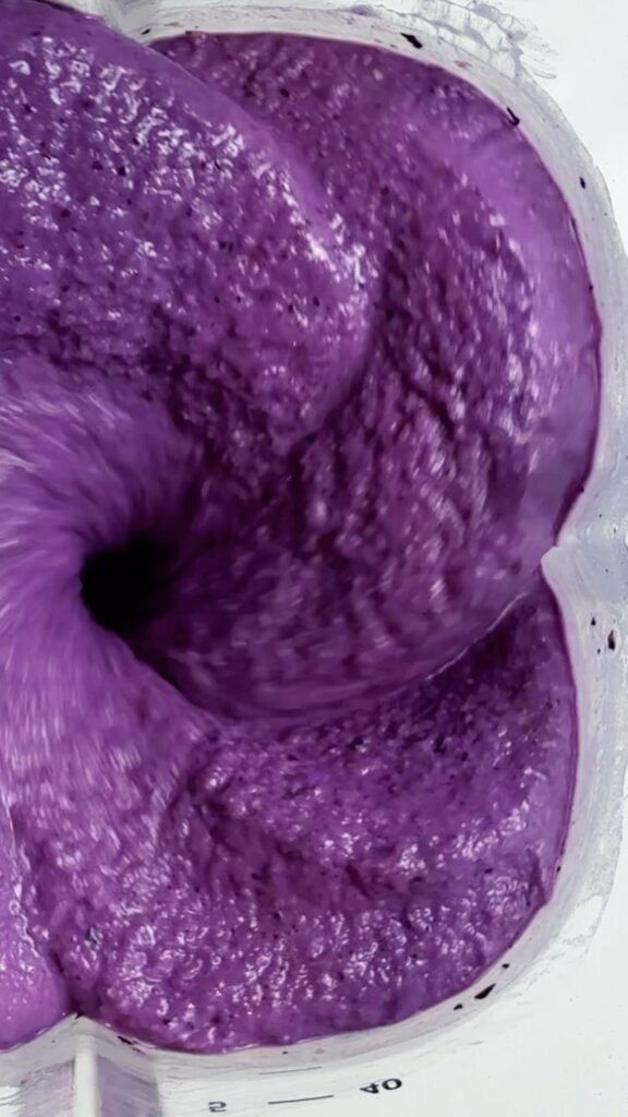 blueberry cobbler smoothie on counter blending