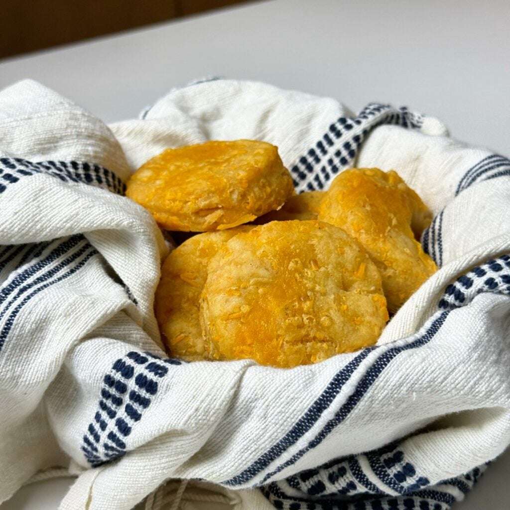 eating greek yogurt cheddar bay biscuits in bowl