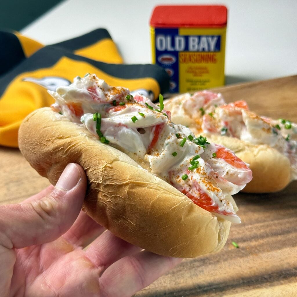 poor mans lobster rolls close up in hand to the side