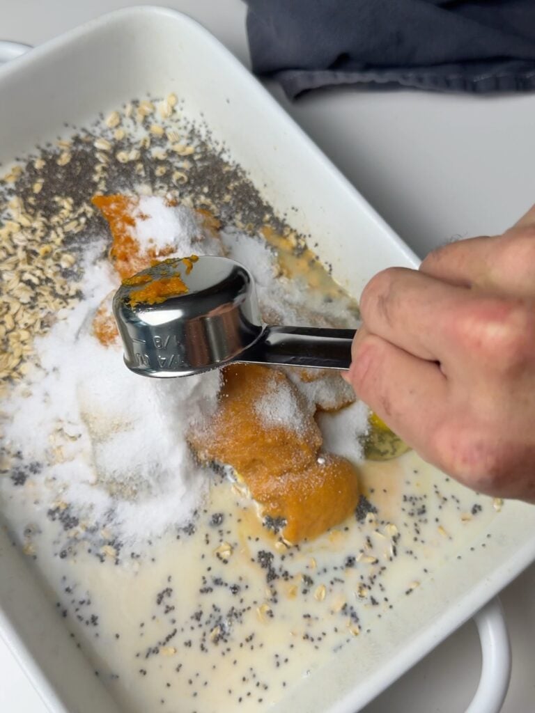pumpkin spice baked oats being mixed