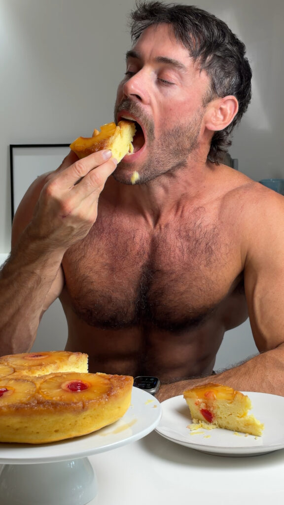 Jacob tasting a slice of high-protein pineapple upside-down cake beside the remaining cake.