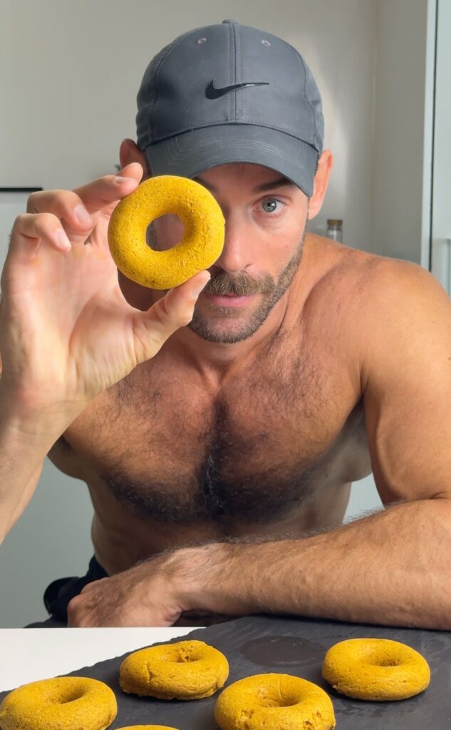 Jacob holding a baked pumpkin spice donut