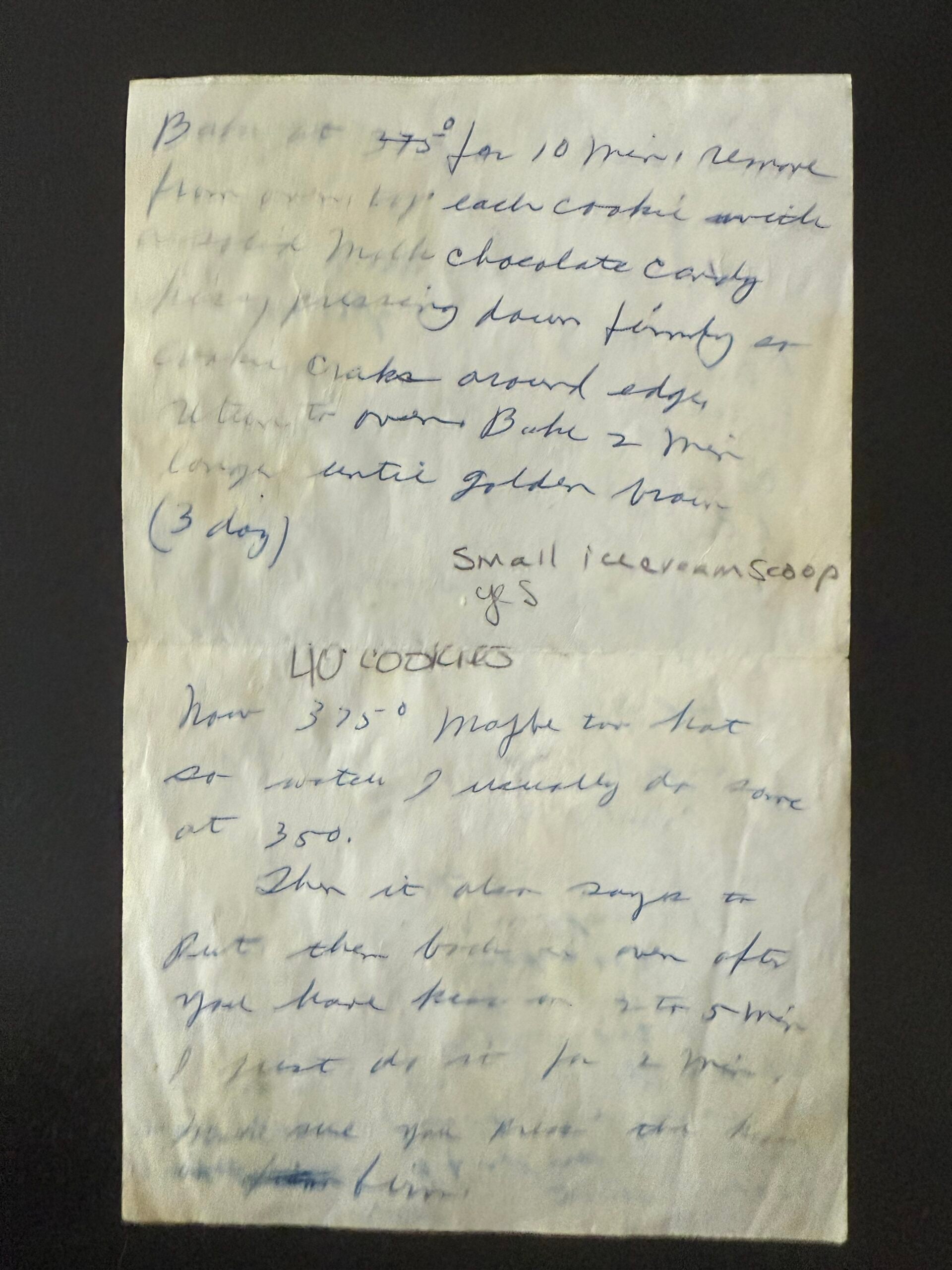Back of a handwritten family recipe card with baking directions for Peanut Butter Blossoms