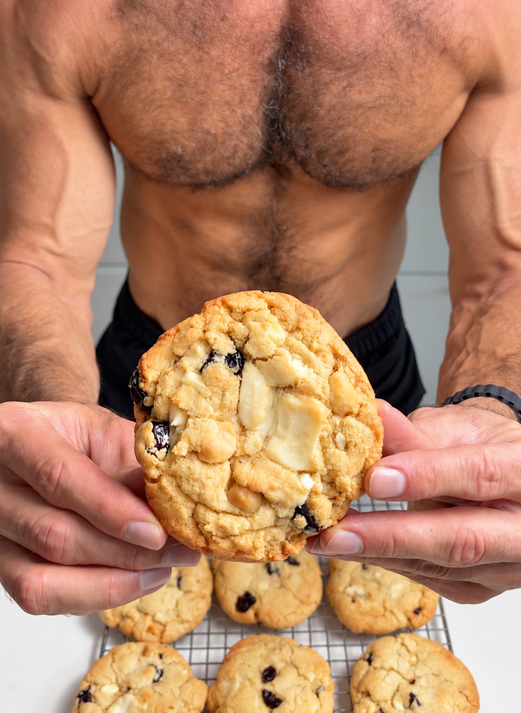 A gluten-free white chocolate cherry almond cookie served on a plate.