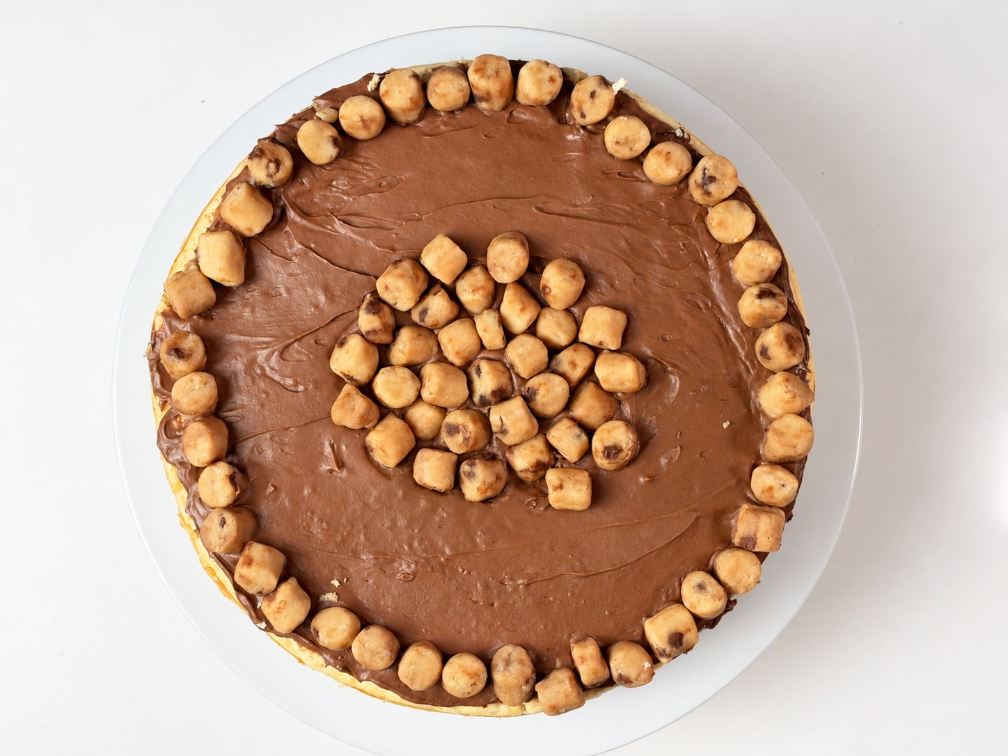 Overhead view of whole high-protein cookie dough cheesecake