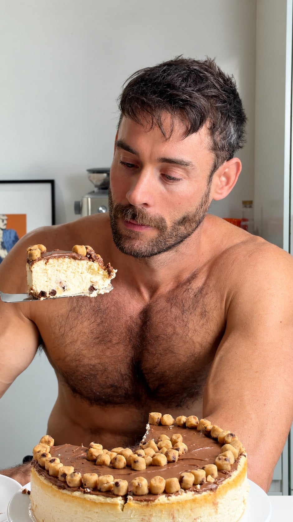 Jacob serving a slice of high-protein cookie dough cheesecake