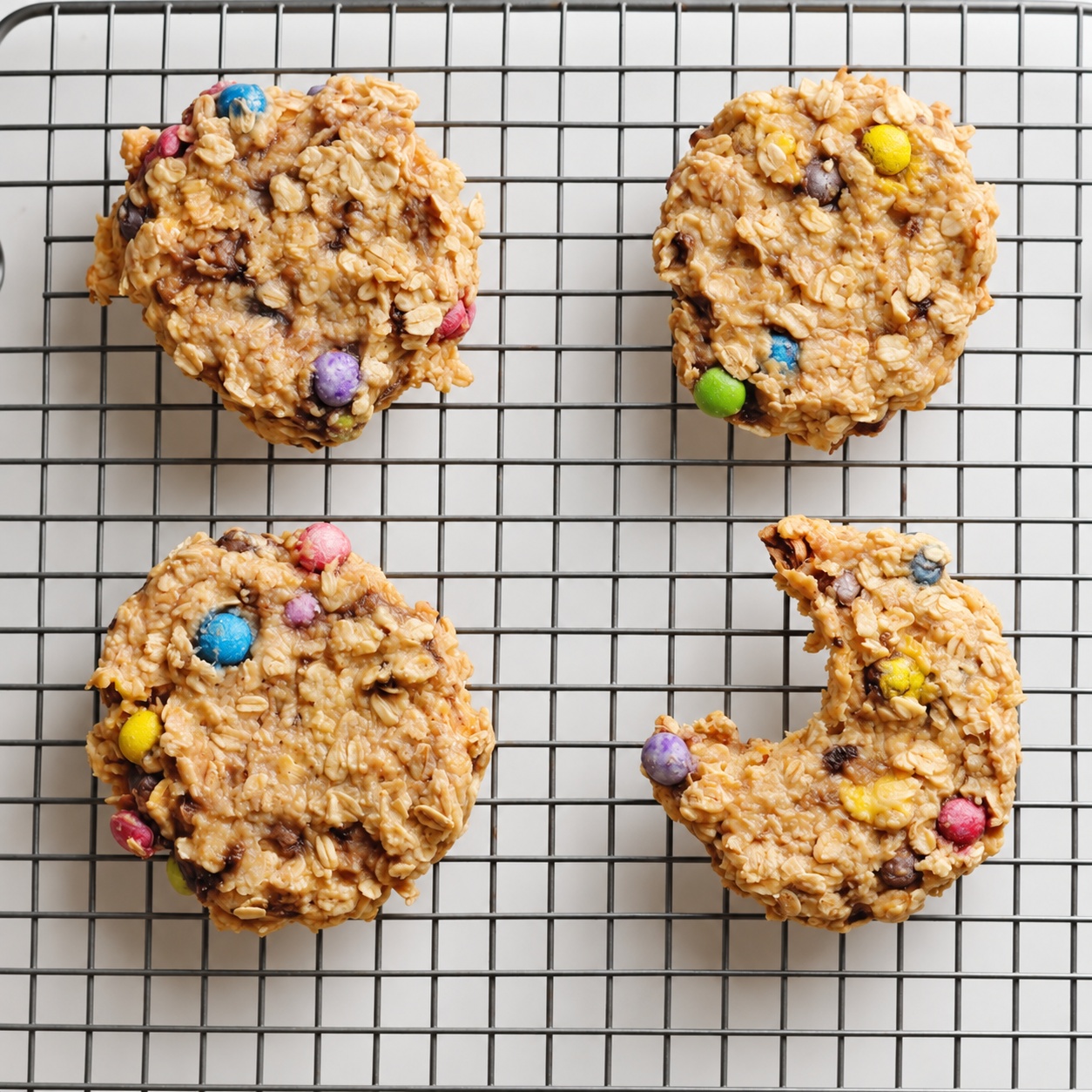 Banana oatmeal M&M breakfast cookies cooling on a wire rack