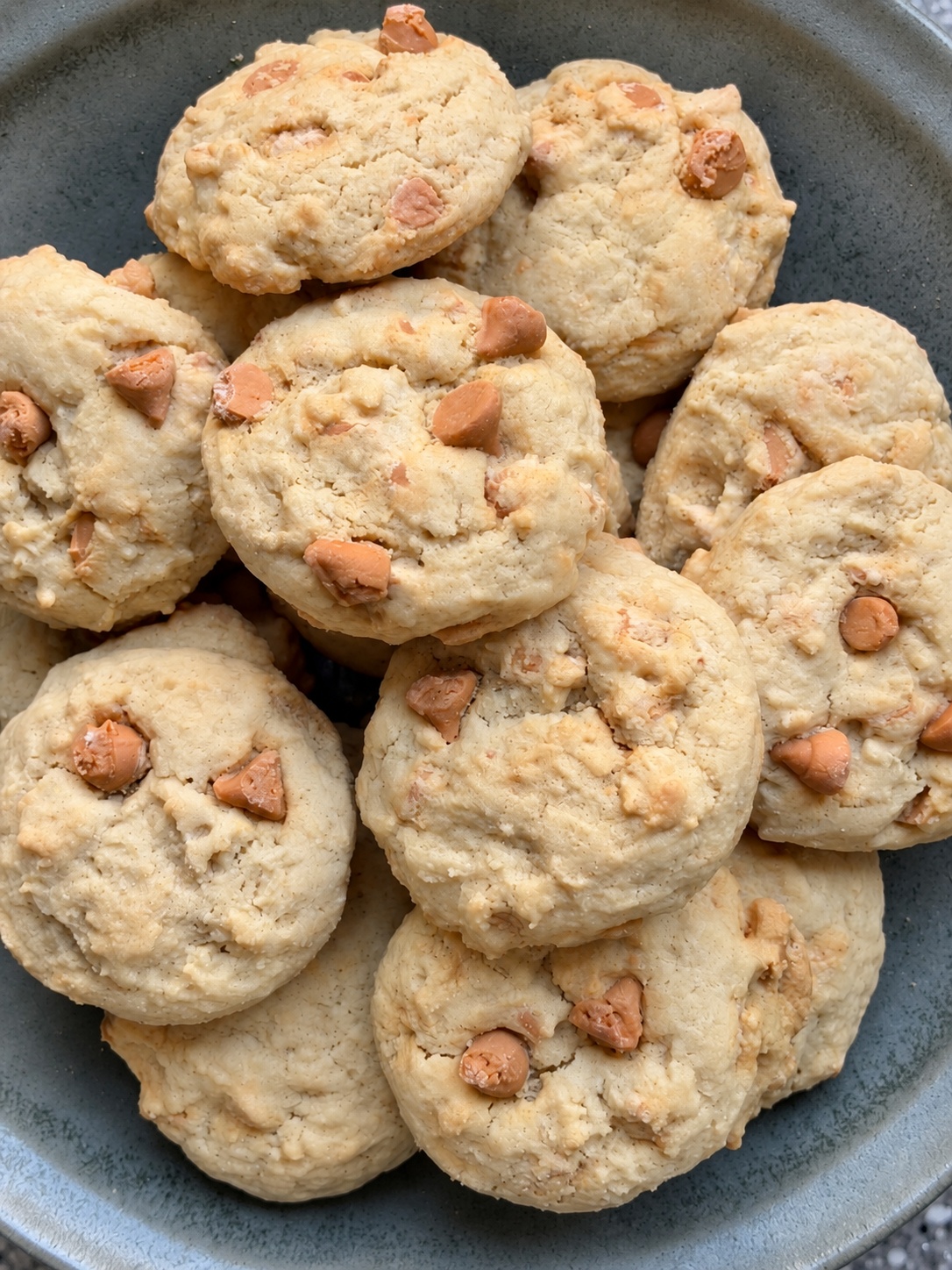 Close-up overhead view of butterscotch chip cookies in a bowl