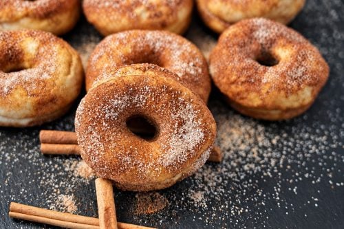 High protein cinnamon sugar donuts on a cooling rack