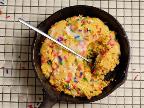 birthday cake protein cookie skillet with a spoon