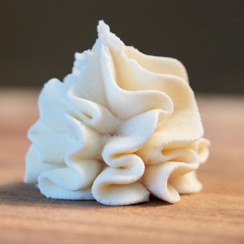 close up cream cheese frosting on board