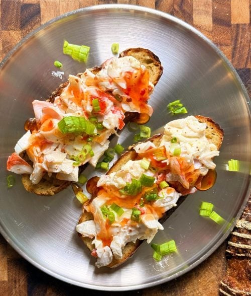 crab rangoon sourdough toast close up on silver plate