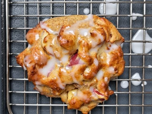 Close-up of a glazed air fryer apple fritter with diced apples