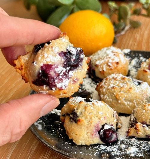 Close up of lemon blueberry donut hole showing soft interior and blueberries