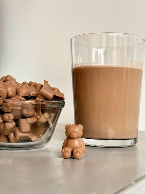 bowl of protein gummies with Nurri mocha shake can in background